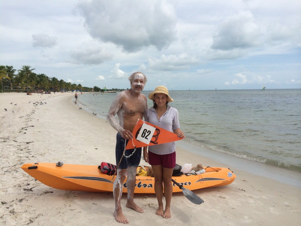 Bill Welzien is pictured with his support kayaker and daughter, Priscilla, after completing his 62nd career swim around Key West on Oct. 8, 2014.